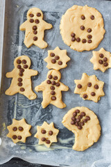 Kids are baking cookies in the kitchen the children are having fun adding ingredients to cook the food