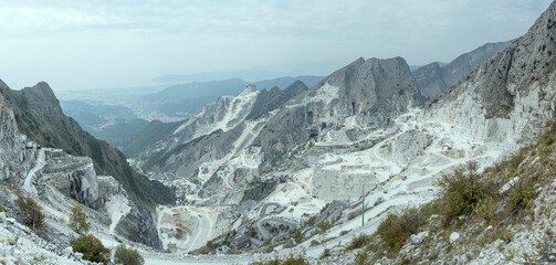 aerial landscape of valley with bending roads and marble quarrys, Carrara, Italy
