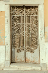liberty wrought-iron grating of old building, Carrara, Italy