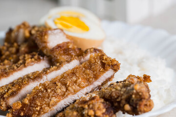 crispy fried pork that uses sweet potato flour with boiled egg and rice