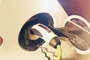 shot of a power supply in by a car charging station