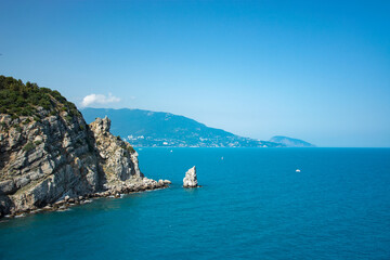 Fototapeta na wymiar On the left is the Black Sea rock. An amazing view of the endless horizon. Crimea, Russia.