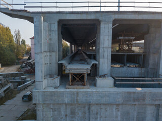 Aerial drone view. Construction of the metro level across the bridge.