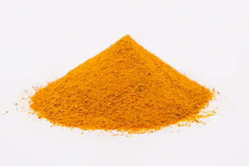 Stack of turmeric a white background.
