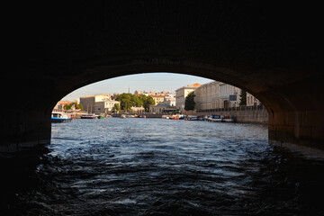 View of the city from under the bridge. Sailing by boat. Saint-Petersburg, Russia.