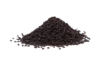 Stack of  black cumin seedson a white background.
