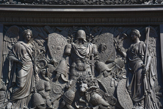 The pedestal of the Alexander Column is decorated with symbols of military glory, sculpted by Giovanni Battista Scotti, in St.Petersburg, Russia