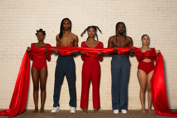 three women in a row with two guys 