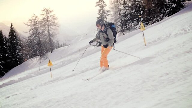 Downhill skiing. Camera tracking along fluently with skier. . High quality FullHD footage