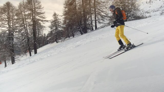 Downhill skiing. Camera tracking along fluently with skier. . High quality FullHD footage