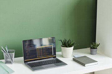 Image of workplace with laptop with business software at home