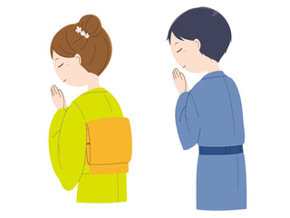 Fototapeta premium 手を合わせ祈る着物姿の女性と男性