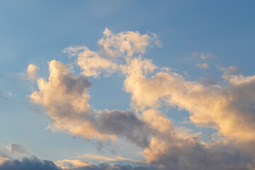 Fototapeta na wymiar Dramatic clouds in the sky illuminated by the sun.