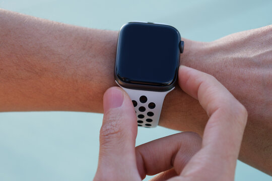 Apple Watch Series 4 with white Nike Sport Band on the wrist outdoor images 03.12.2019 Bornova, Izmir, Turkey