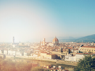 Fototapeta na wymiar Panorama landscape of Florence and Cathedral Saint Mary of the Flower. Beautiful cityscape of Firenze, Arno river and Duomo Santa Maria del Fiore in sun lights