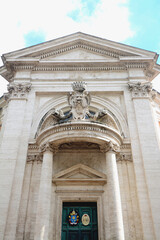 Fototapeta na wymiar Architectural details and baroque ornaments in marble and travertine of the Church of Sant'Andrea al Quirinale.