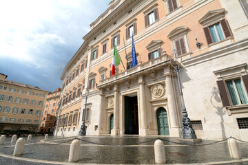 Fototapeta na wymiar Palazzo Montecitorio is in Piazza del Parlamento near Piazza di Monte Citorio. It houses the Chamber of Deputies of the Italian Republic and the Italian Parliament