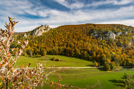 Colorful view of Bronnen Castle on the hiking trail in autumn in the Danube valley near Beuron