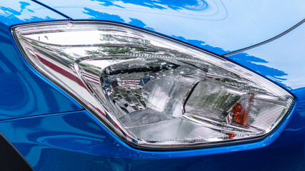 Detail of a luxury Modern blue car headlights. Led car headlights.