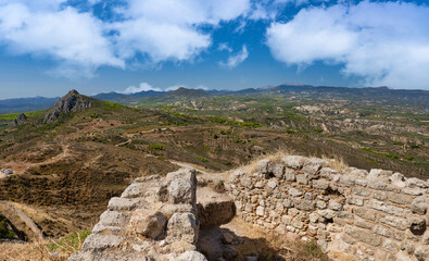 Fascinating ruins of the .Acrocorinth (Upper Corinth), the acropolis of ancient Corinth, overseeing the ancient city of Corinth
