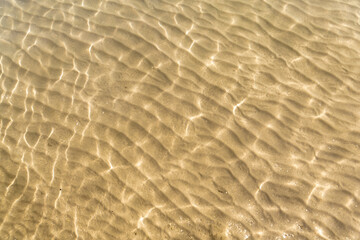 Fototapeta na wymiar Beautiful sand and water patterns on the crystal cleat water of the mediterranean sea, Peloponnese (Peloponnesus) Peninsula, Mainland Greece