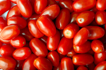 Red ripen cherry tomatoes. Pattern, top view, macro shot.