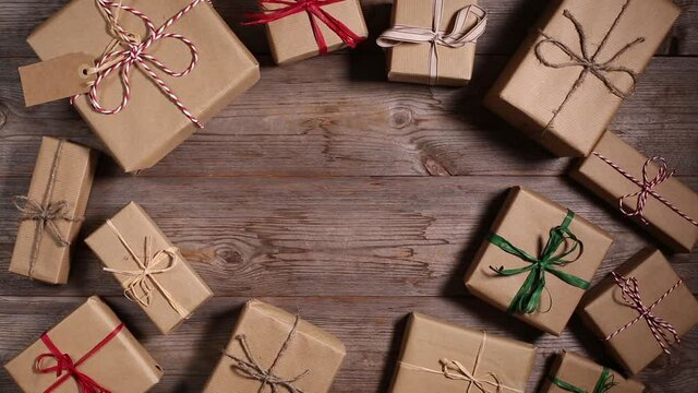 Creative zero waste Christmas concept. Wrapped gift boxes in handmade eco friendly craft paper. Seasonal, holidays, New Year decoration.