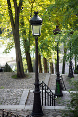 View of street lights in a paved stairs in montmartre quarter in Paris