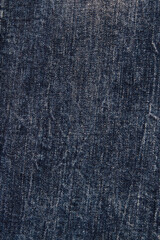 close-up of denim cloth, dark jeans texture closeup