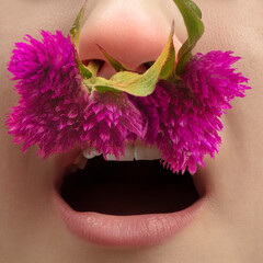 Flowers. Close up human nose with allergen causes a runny nose and sneezing. Creative artwork,...
