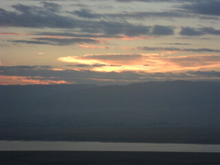 Sunrise hiking to the old ruins of the Archeological site of Masada in Israel byt the Dead Sea