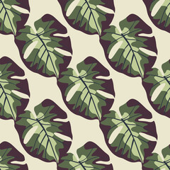 Jungle seamless pattern with monstera leaf ornament. Green colored foliage on light pink background.