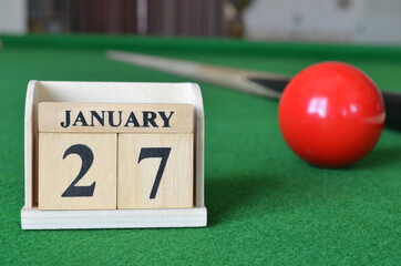 January 27, number cube with balls on snooker table, sport background.