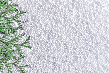 Spruce branches on a white snow background. New Year and Christmas concept.