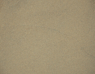 Fototapeta na wymiar Fine wet beach sand that can be used as background