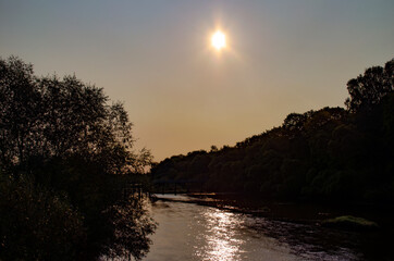 Fototapeta na wymiar Morning sunrise over the river. Beautiful summer landscape.