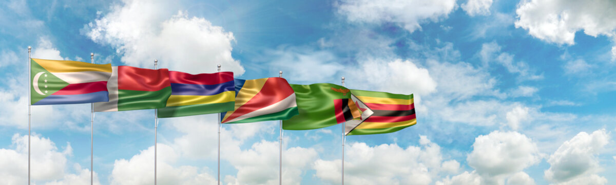 3D Illustration with the national flags of six ESA countries (Eastern and Southern Africa) waving against blue sky