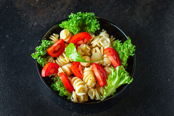 pasta salad tomato vegetables lettuce healthy gluten free ingredient vitamins snack top view copy space for text food background rustic