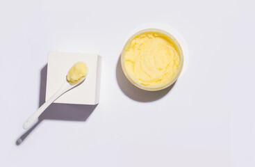 Cleansing scrub yellow. View from above. White background. Copy space