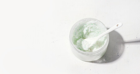 Homemade scrub in a jar on a white background. Copy space. Banner
