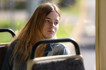 Young lovely passenger at the public transport