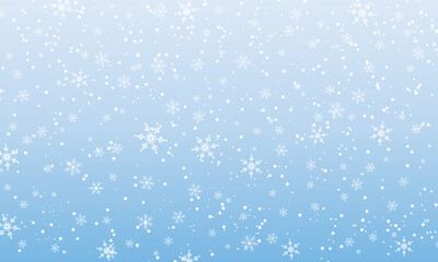 Snow background. Winter snowfall. White snowflakes on blue sky. Christmas background. Falling snow.