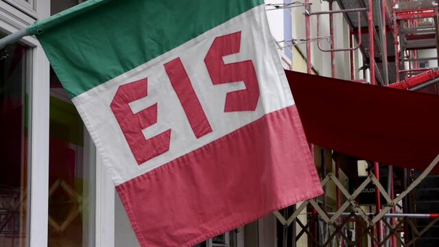 Close up shot of Italian flag, indicating place where sells ice cream or Gelato, in Berlin, Germany