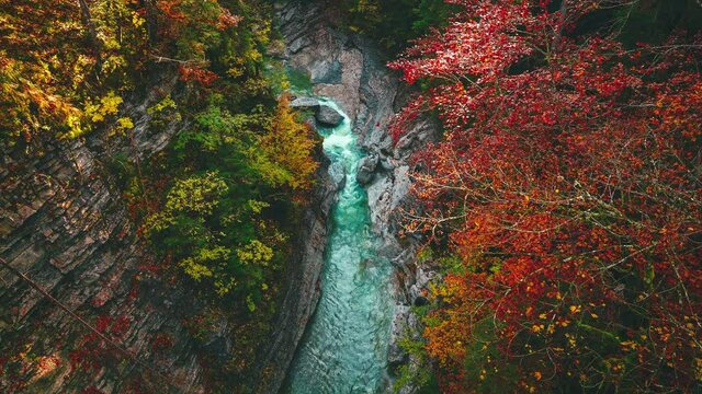 4K UHD Cinemagraph / seamless video loop of a mountain river in the Bavarian / German alps, close to the Austrian border and Sylvenstein in autumn. The water is rushing through naturally formed rocks.