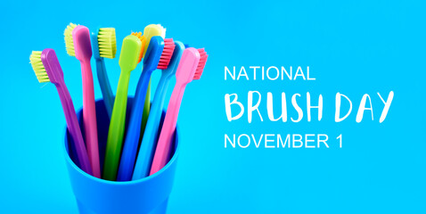 National Brush Day stock images. Colored toothbrushes stock images. Morning hygiene concept. Bathroom accessories images. Toothbrushes in a cup photo. Brush Day Poster, November 1. Important day