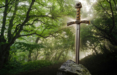 Excalibur, the mythical sword in the stone of King Arthur. - obrazy, fototapety, plakaty