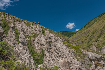 Fototapeta na wymiar A stone mushrooms in a Chulyshman valley in Altai mountains