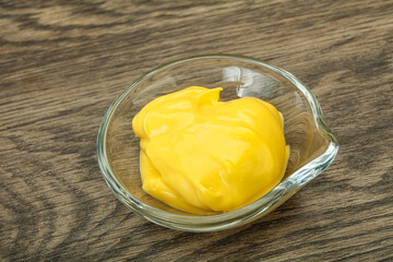 Natural cheese sauce in the bowl
