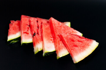 Watermelon slices located at the overlapping diagonally.
