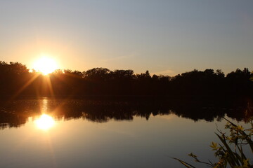 Obraz premium sunset over the river